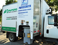 Step 2 | Your records lifted by the shredding trucks mechanical arm and emptied into Papersmith Mobile Shredding's Shred Truck